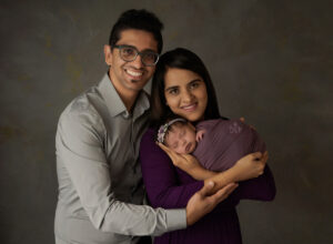 Austin Newborn Photographer baby girl in purple with parents